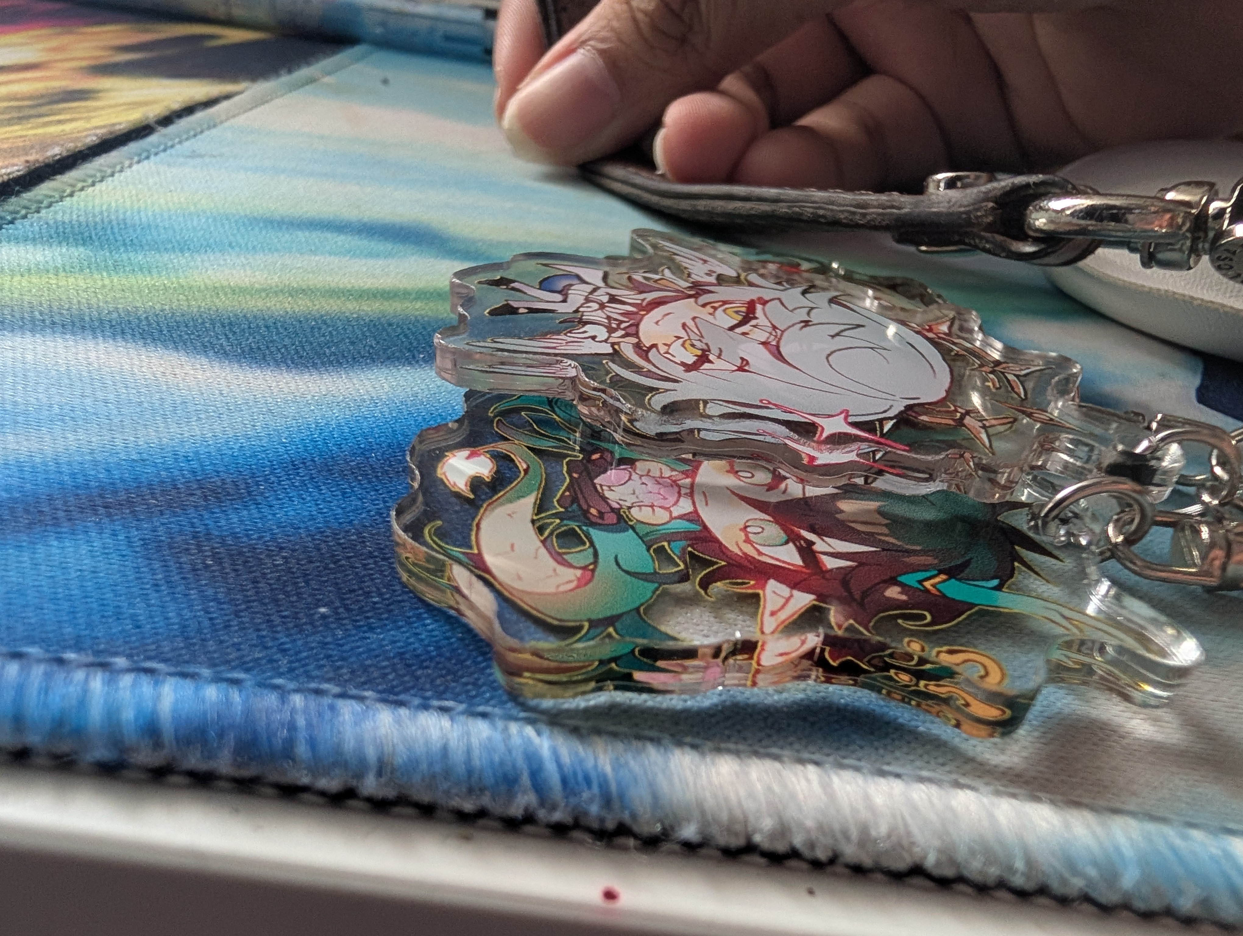 One way that people can identify if I'm coming is through keychains. I have a lot on my phone and keep a lot on my bags. they click against one another, making a slightly annoying sound depending on who hears it. It's funny when I get called out for it. The keychaisn that I own usually feature characters from series that I enjoy and created by small or lesser known fanartists that had art that appealed to me.<br><audio controls src='Noises/Phone shake.m4a'></audio>